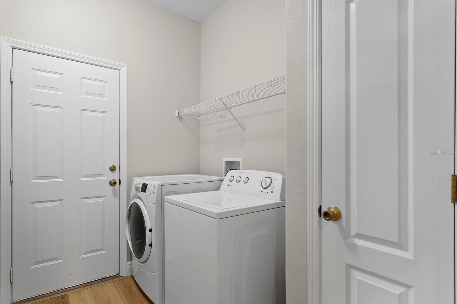 The inside utility room includes a linen closet, washer & gas dryer and connects to the 2-car garage