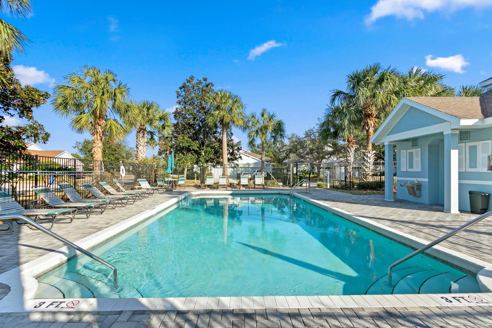 The community pool is located just across the street from this home