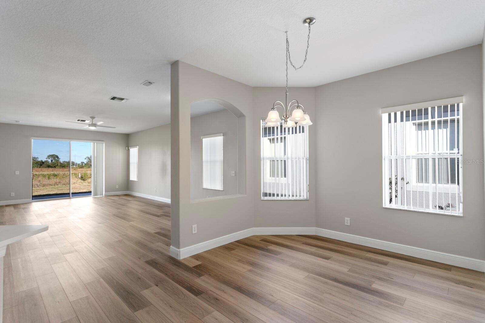 The large formal dining space is adjacent to the living room