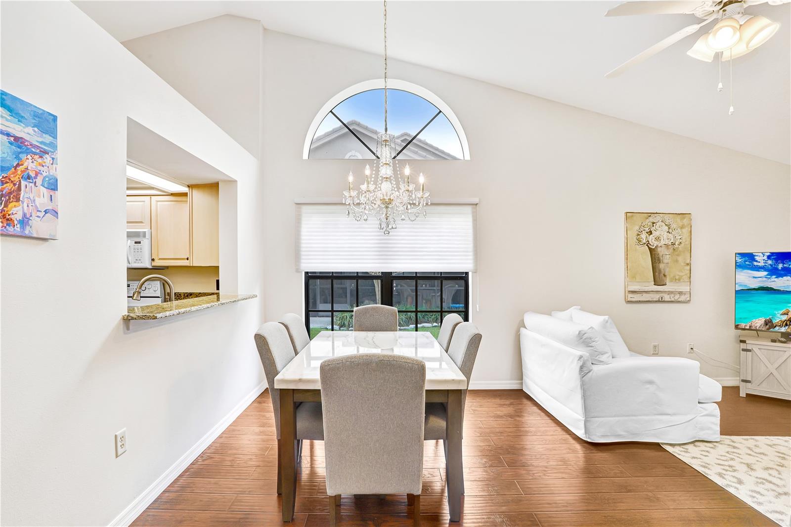 The window over the dining area is expansive + classic!