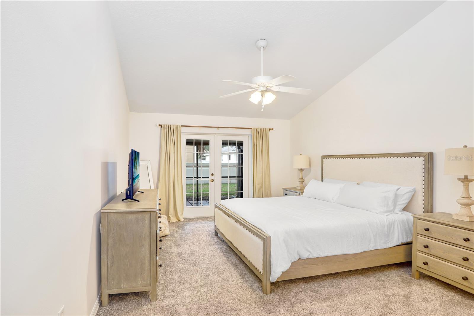 The primary bedroom is spacious with beautiful vaulted ceilings and a large walk in closet