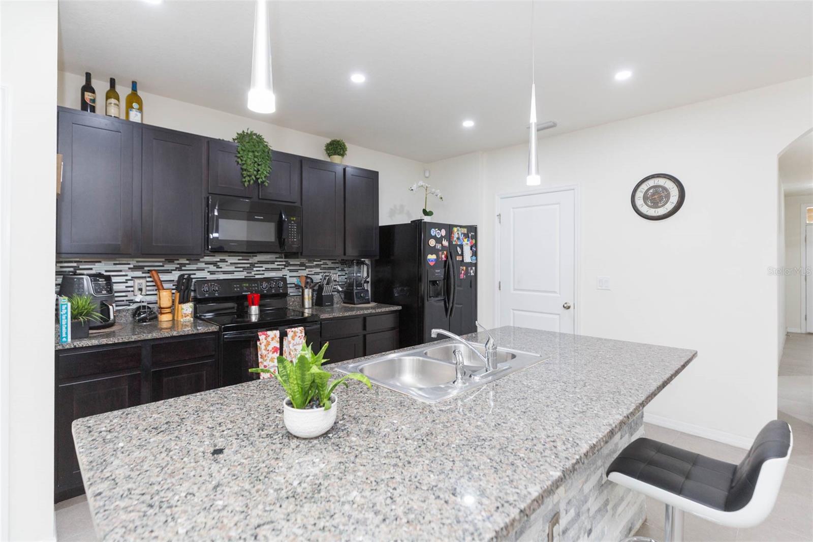 Large spacious island in kitchen with pantry