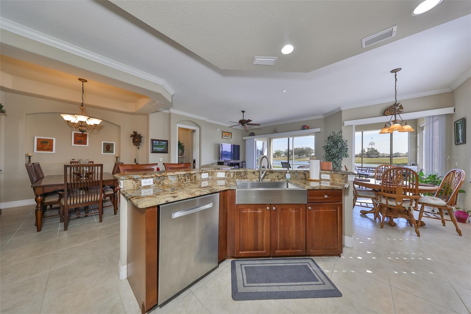 The open concept ensures that you are always a part of the action.  Notice the large modern sink and water views.