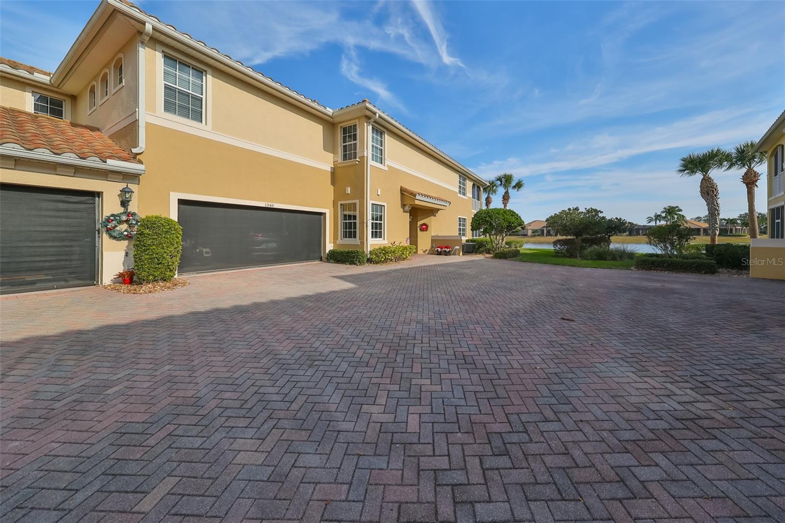 Garage has a screen which allows the sea breezes to flow into the home.  The brick driveway is spacious for parking.