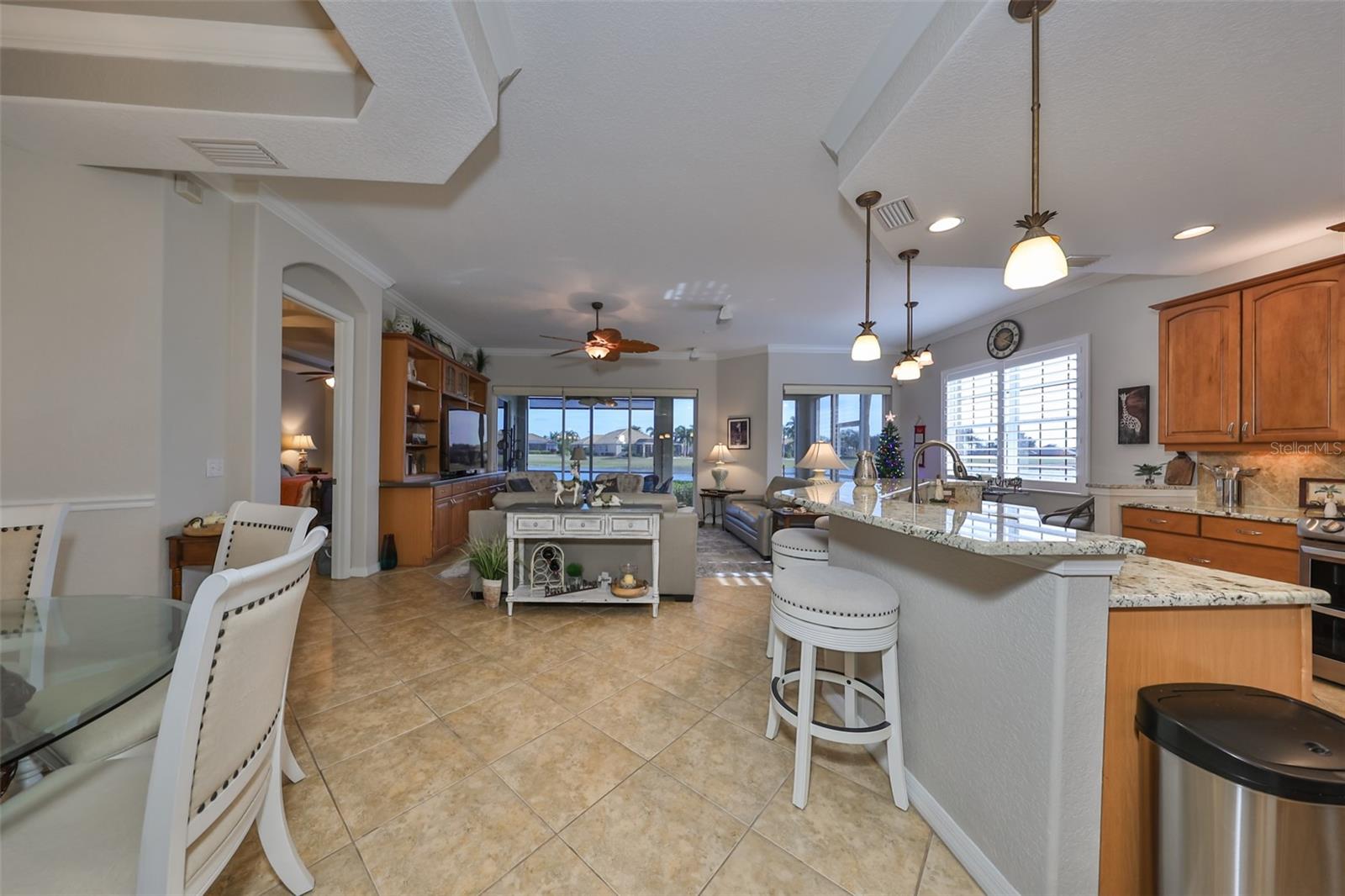 From the foyer you walk right into an OPEN FLOOR plan with a wall to wall water view.