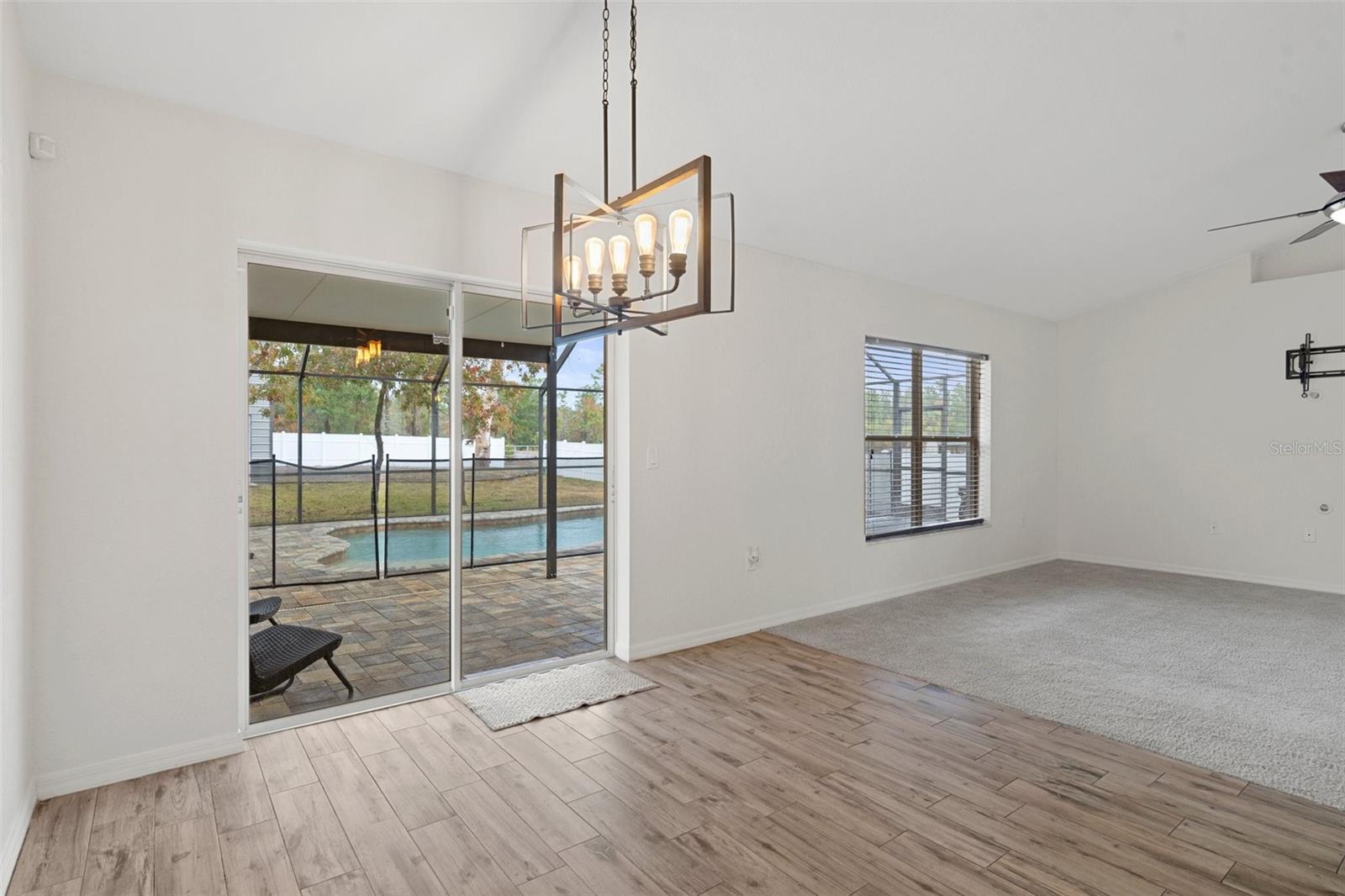 This is the Dining Area with sliding glass doors out to the Gorgeous Pool