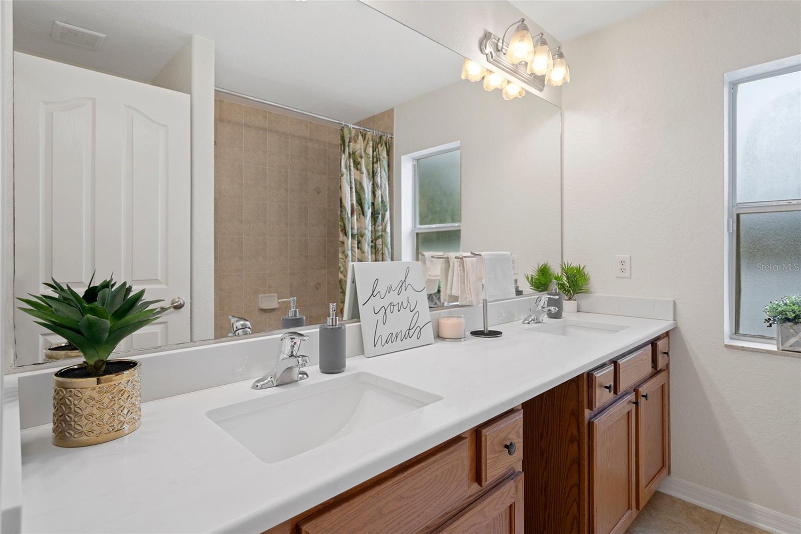 The Guest Bathroom has Dual Sinks