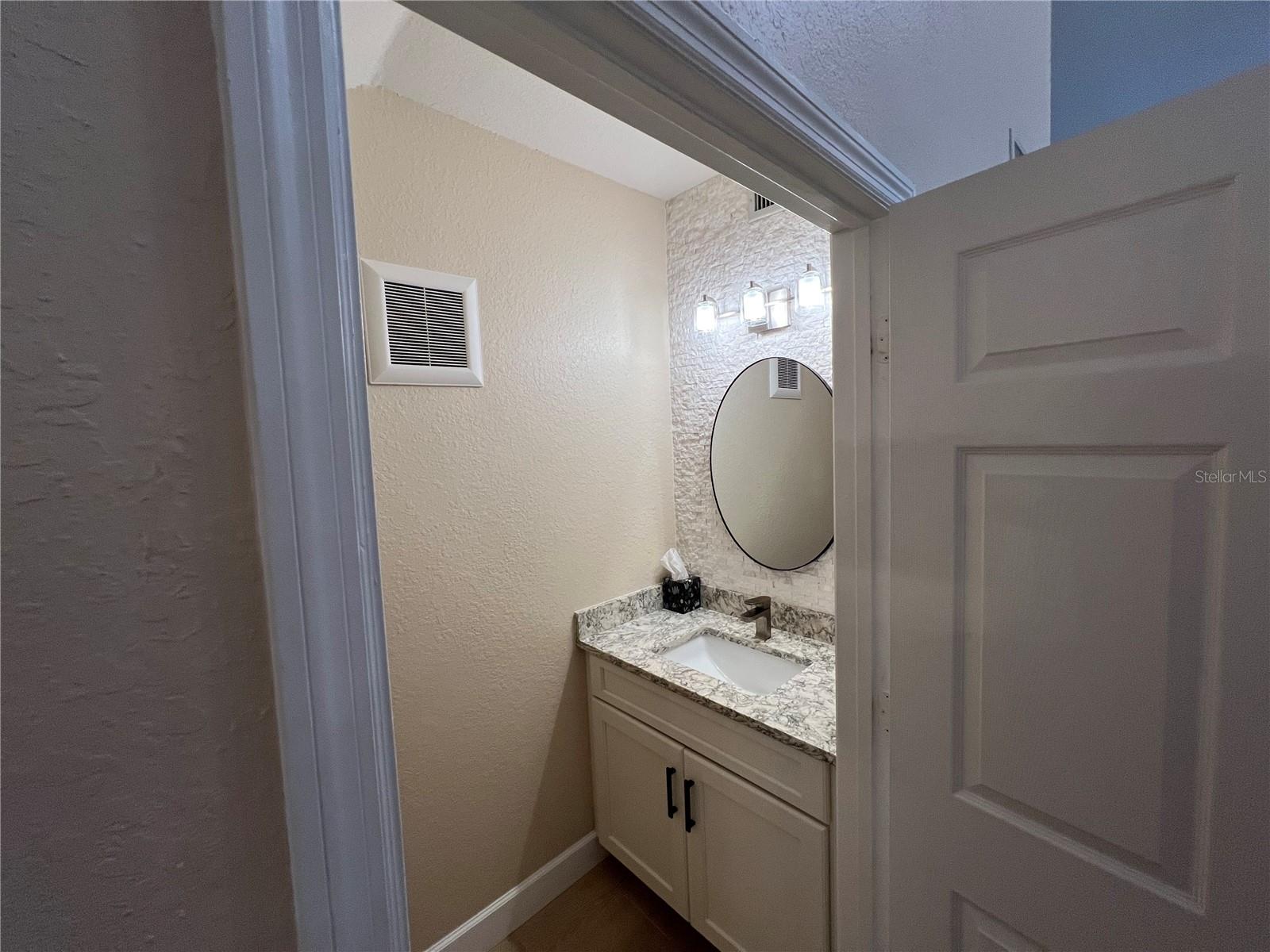 Half bath under the steps with room to build a closet.