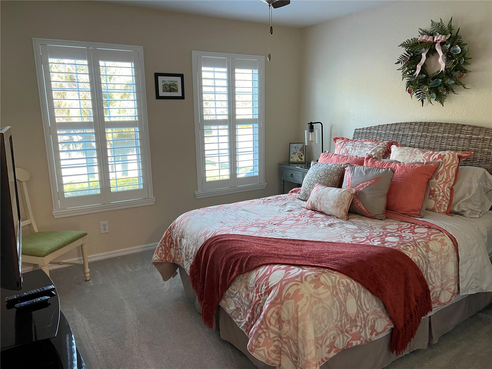 3rd spacious bedroom with plantation shudders and built in closet