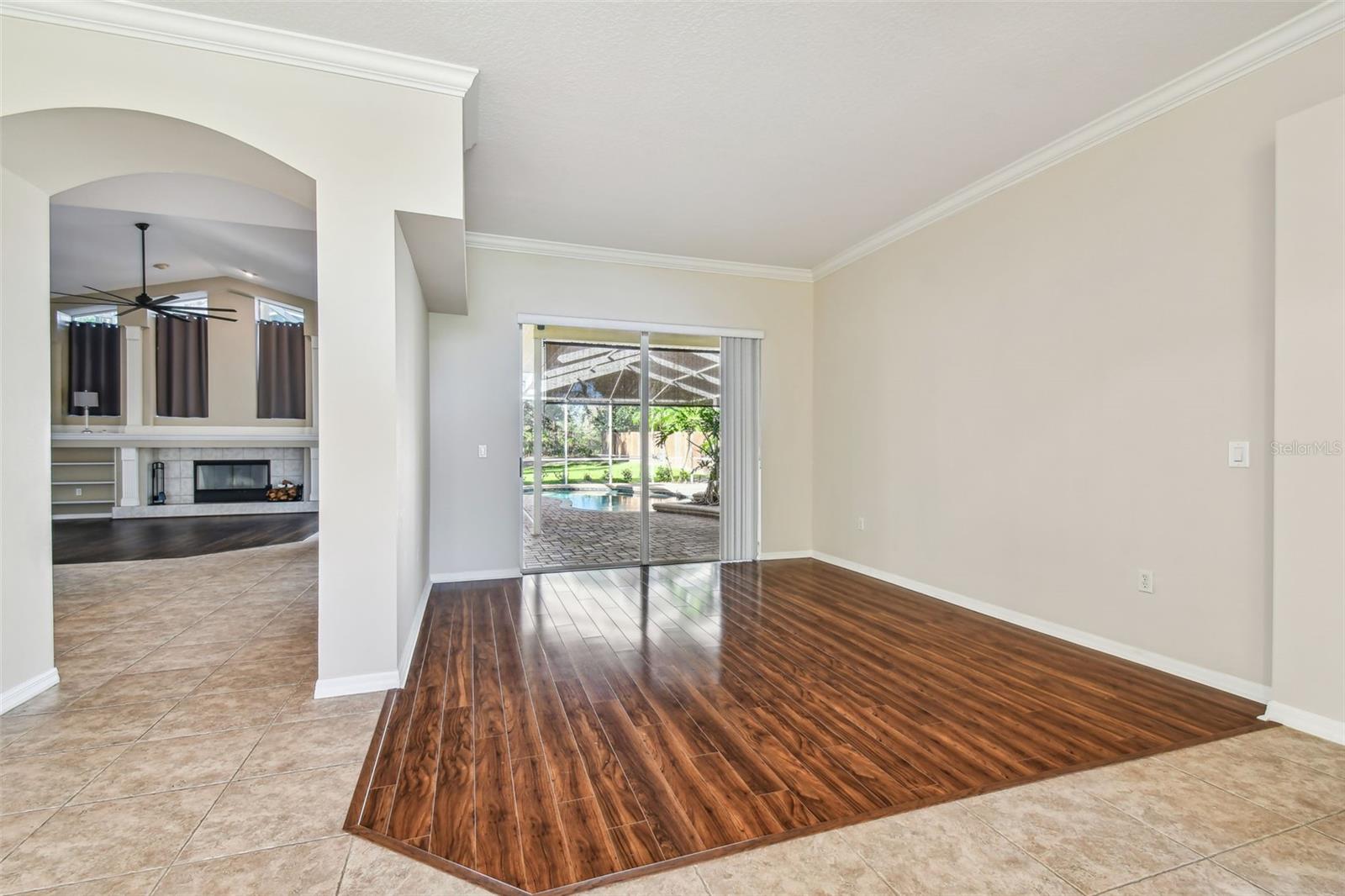 Living Room with sliders that lead out to the pool//spa.