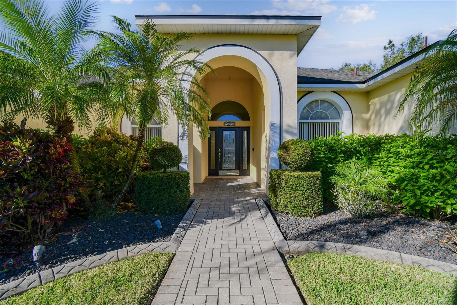 Impressive entry way and well maintained landscaping.