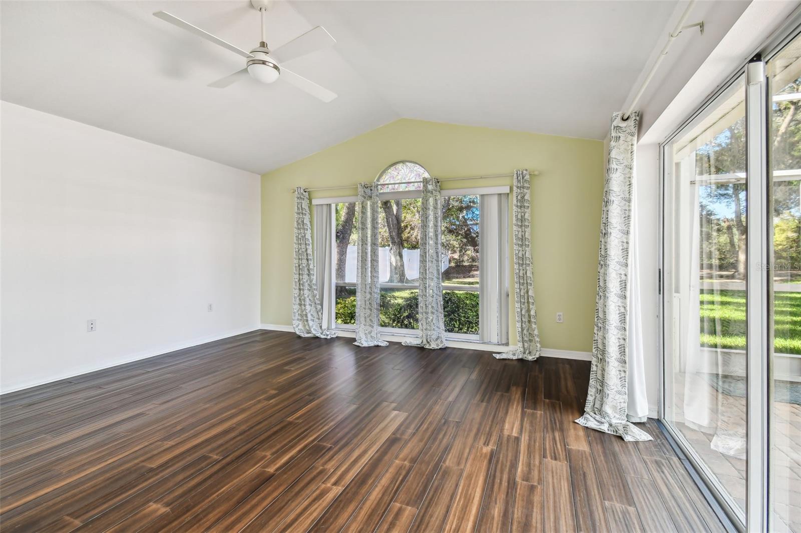 Bonus room located at the back of the home with over sized sliders leading out to the pool/spa.