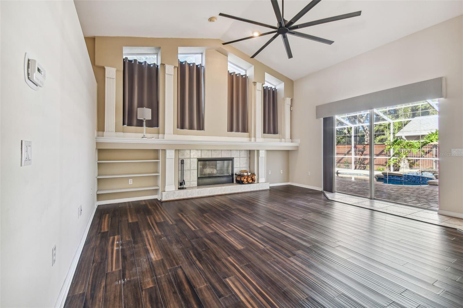 The high ceilings really accentuate the space and the sliders open up to the gorgeous pool/spa area.