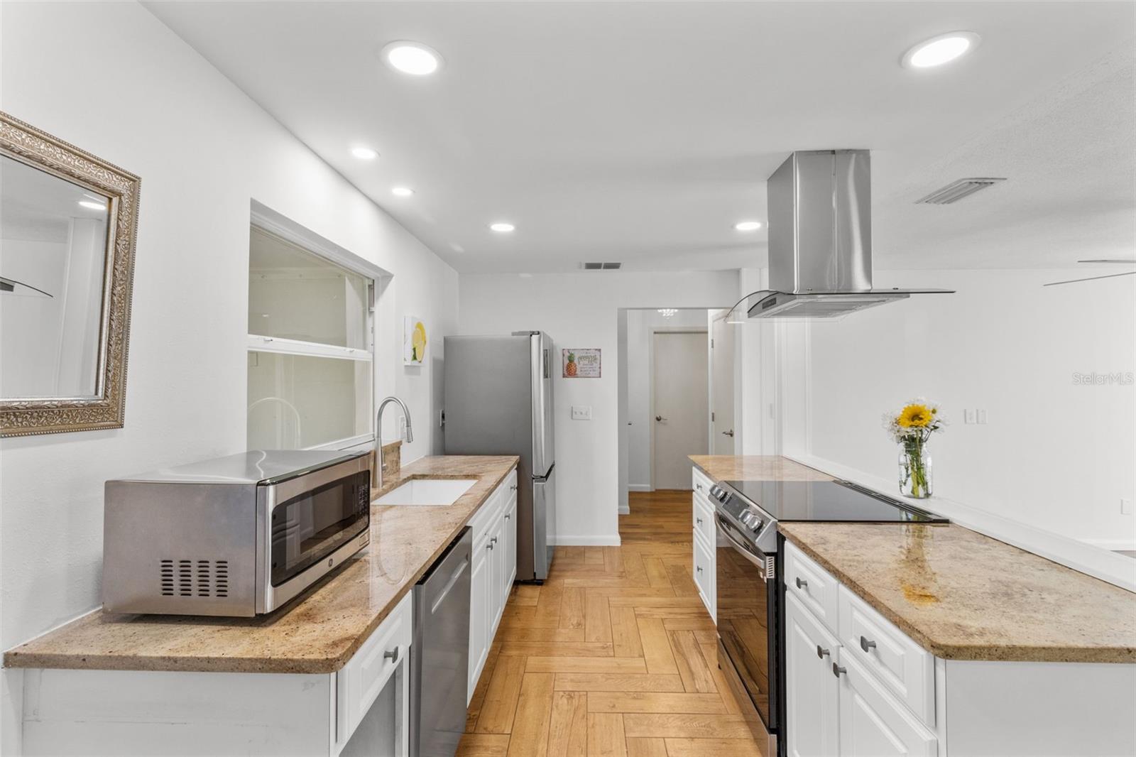 Open kitchen with new appliances.