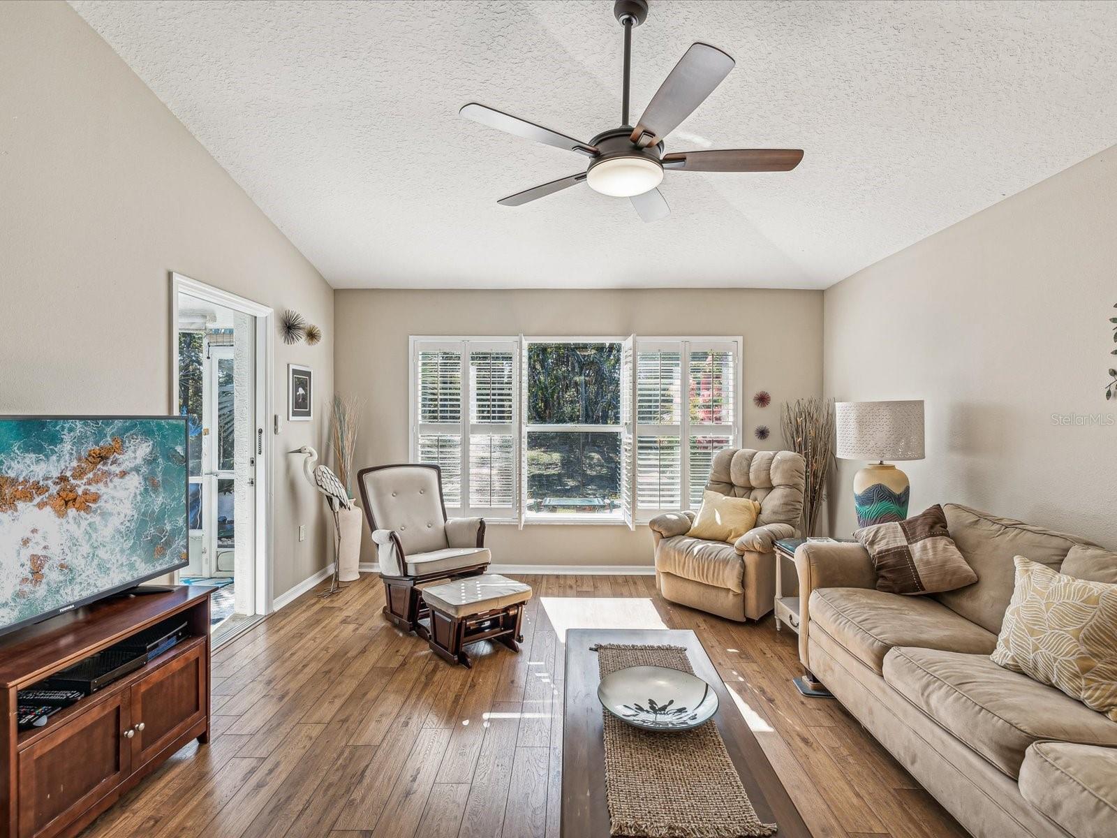 Living room, dining room that opens to Florida room