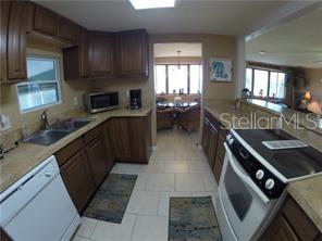 PRIOR - Kitchen view looking toward the dining area & canal.