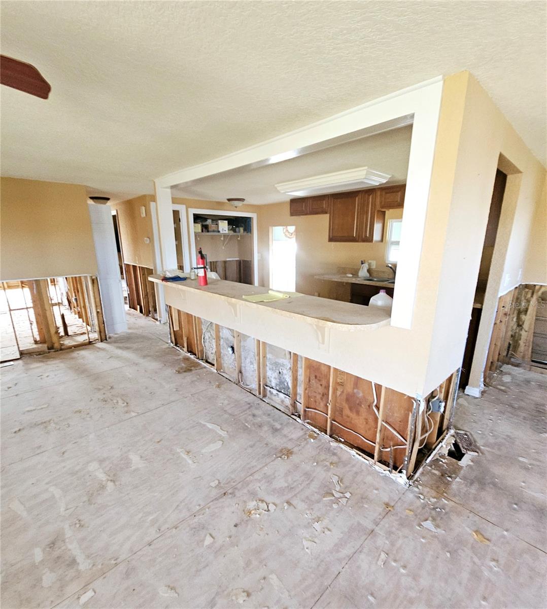 Living room looking into the kitchen area  Lots of room for seating along the counter. open  floor plan.