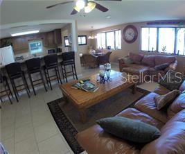 PRIOR - view from Living room looking toward the dining room and kitchen, A GREAT floor plan were all the living space is facing the canal with lots of windows and natural light,