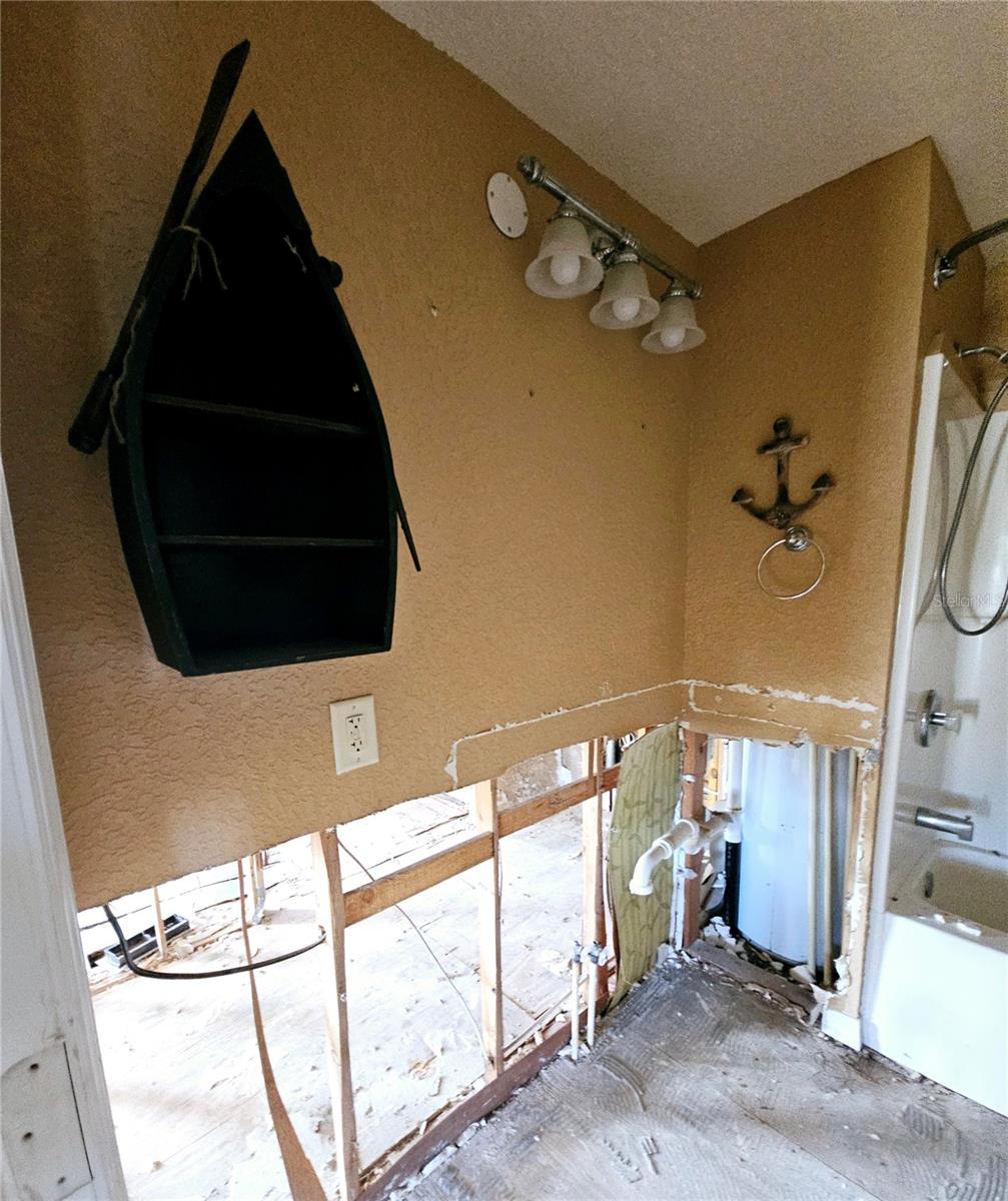 Main bathroom. Vanity was located in this area. Behind this wall is the masters walk in closet.