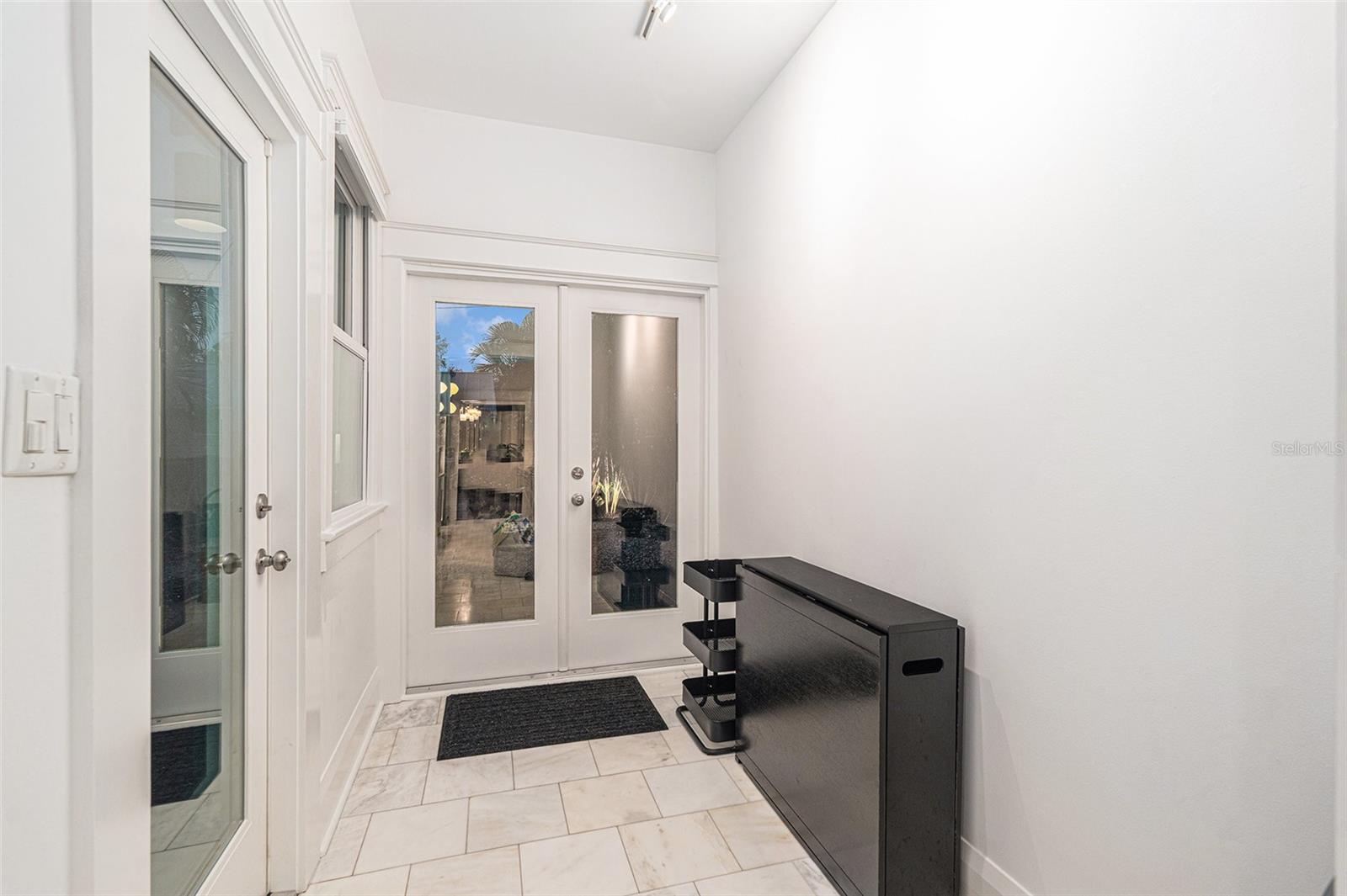 Staging area between kitchen and backyard