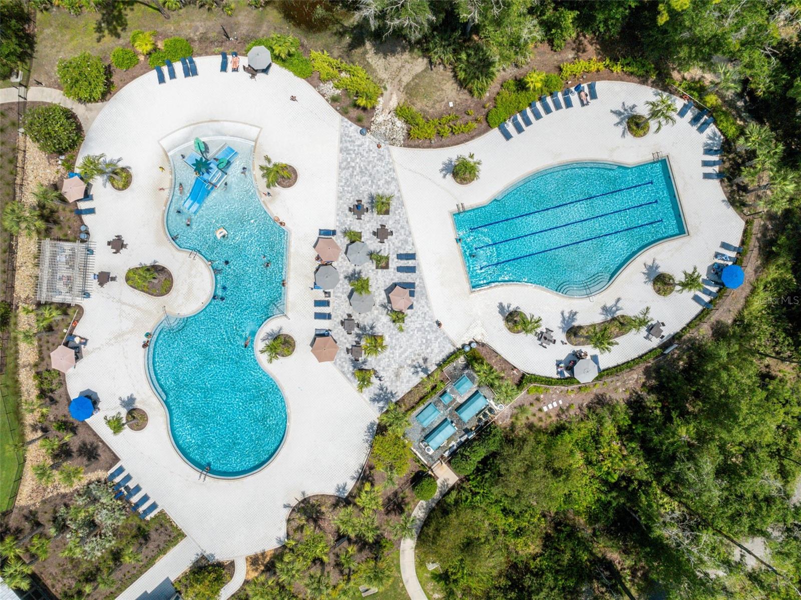 Main Pool complex, w/ slide, play structure, and heated lap pool.