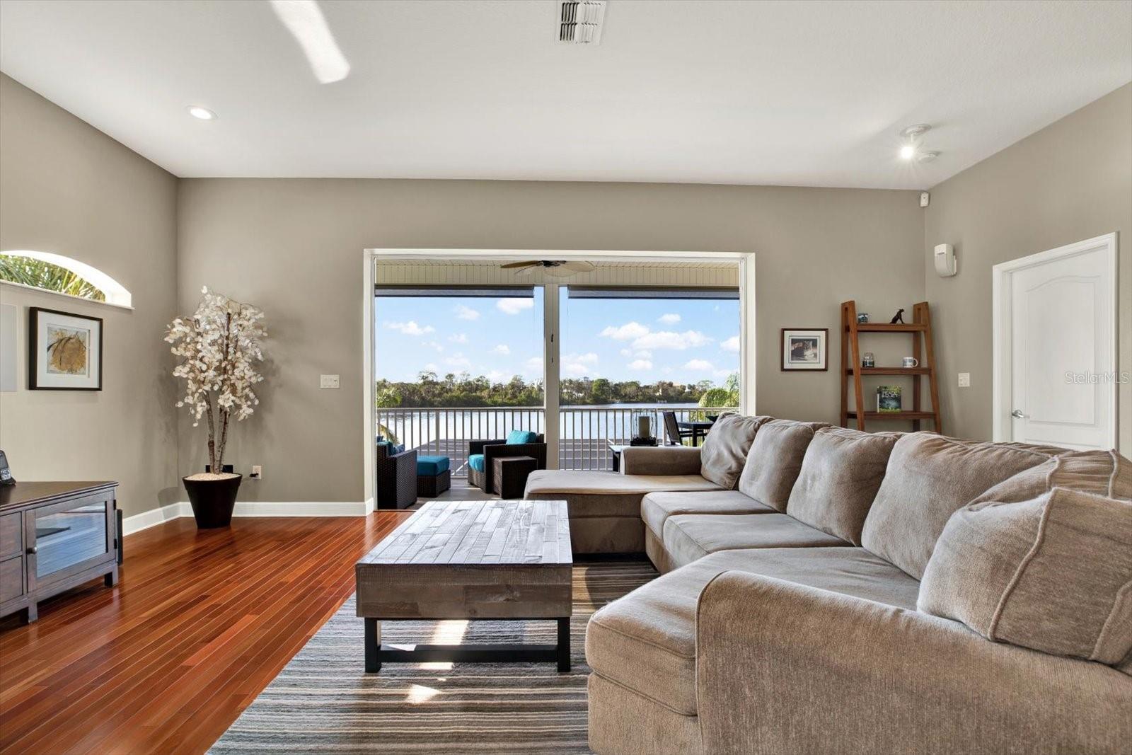 Living area out to screened porch overlooking Oyster Bayou!