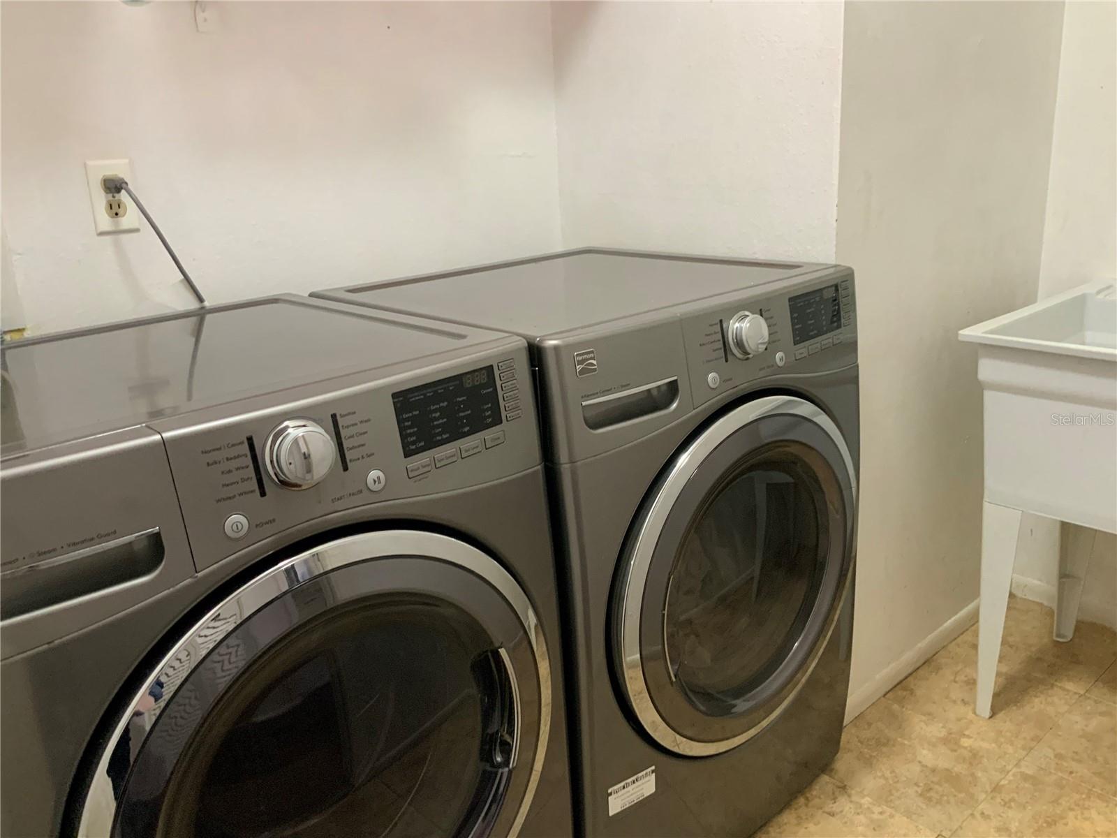 Laundry room with wash tub