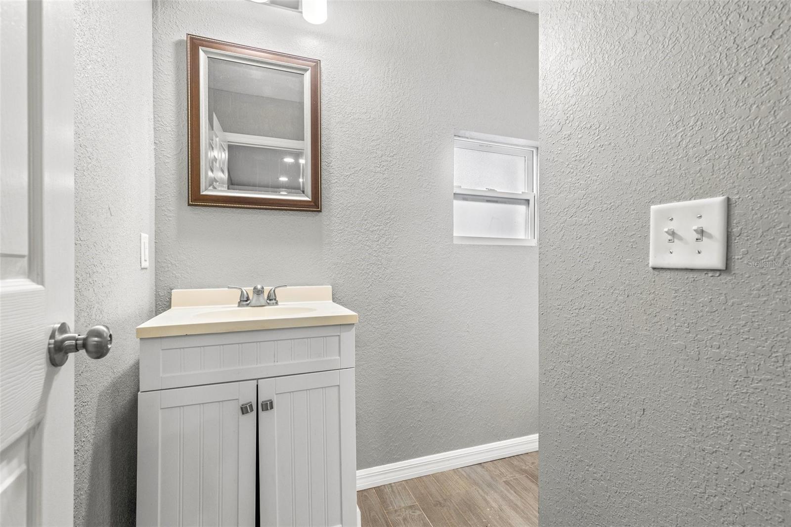 Downstairs full bathroom with tub.