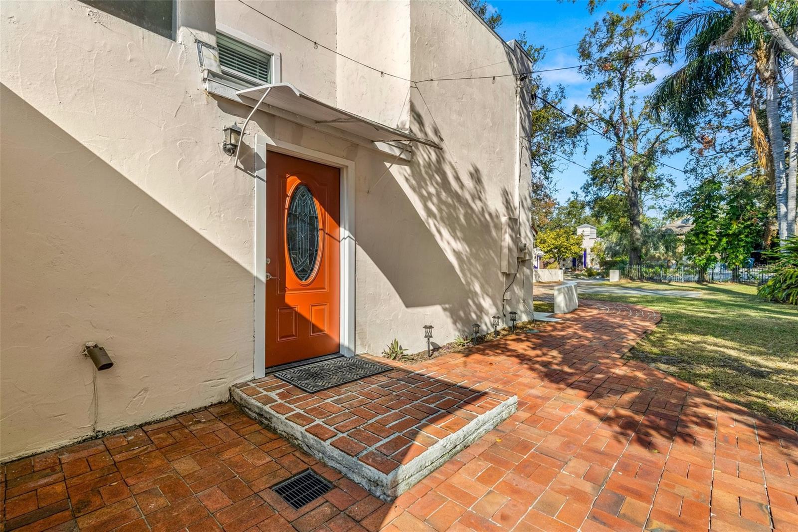 Front door opens onto a lighted patio.