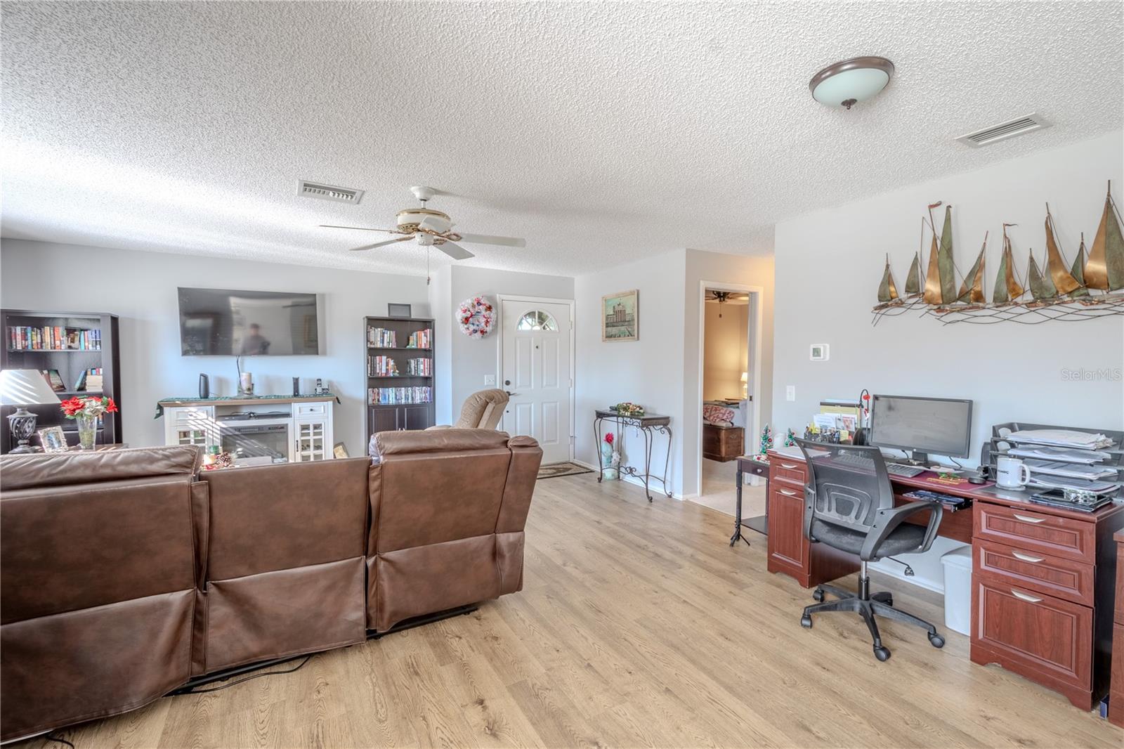 The living room is open to the dining area.