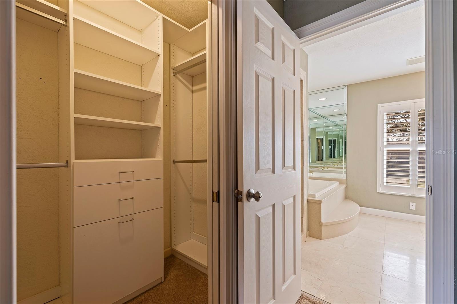 Primary bedroom walk-in closets (2)