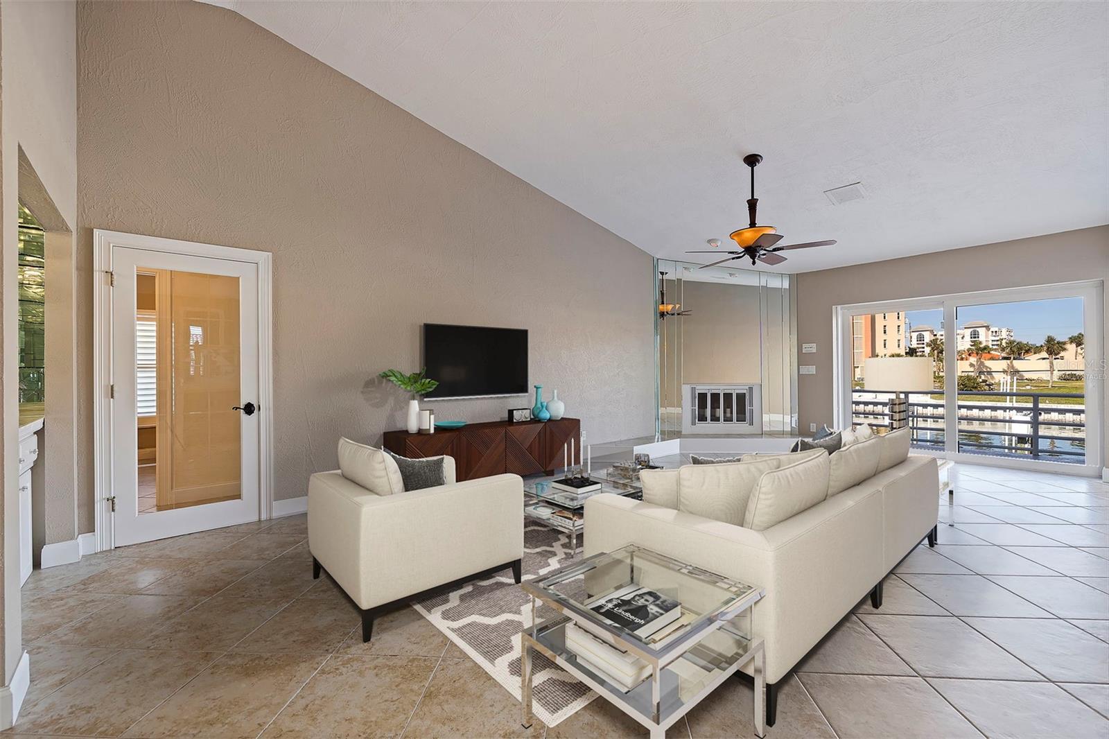 Living room with wood burning fireplace.  This photo has been virtually staged.