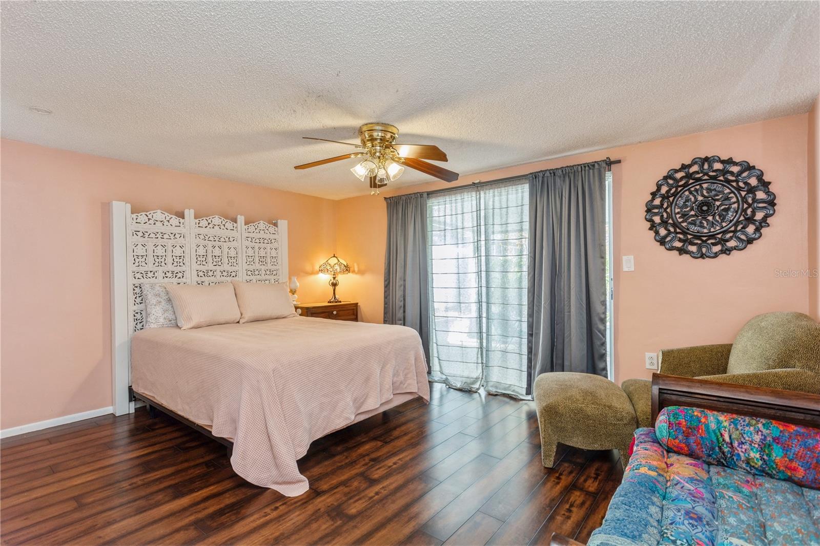 Primary bedroom with sliding doors to back patio