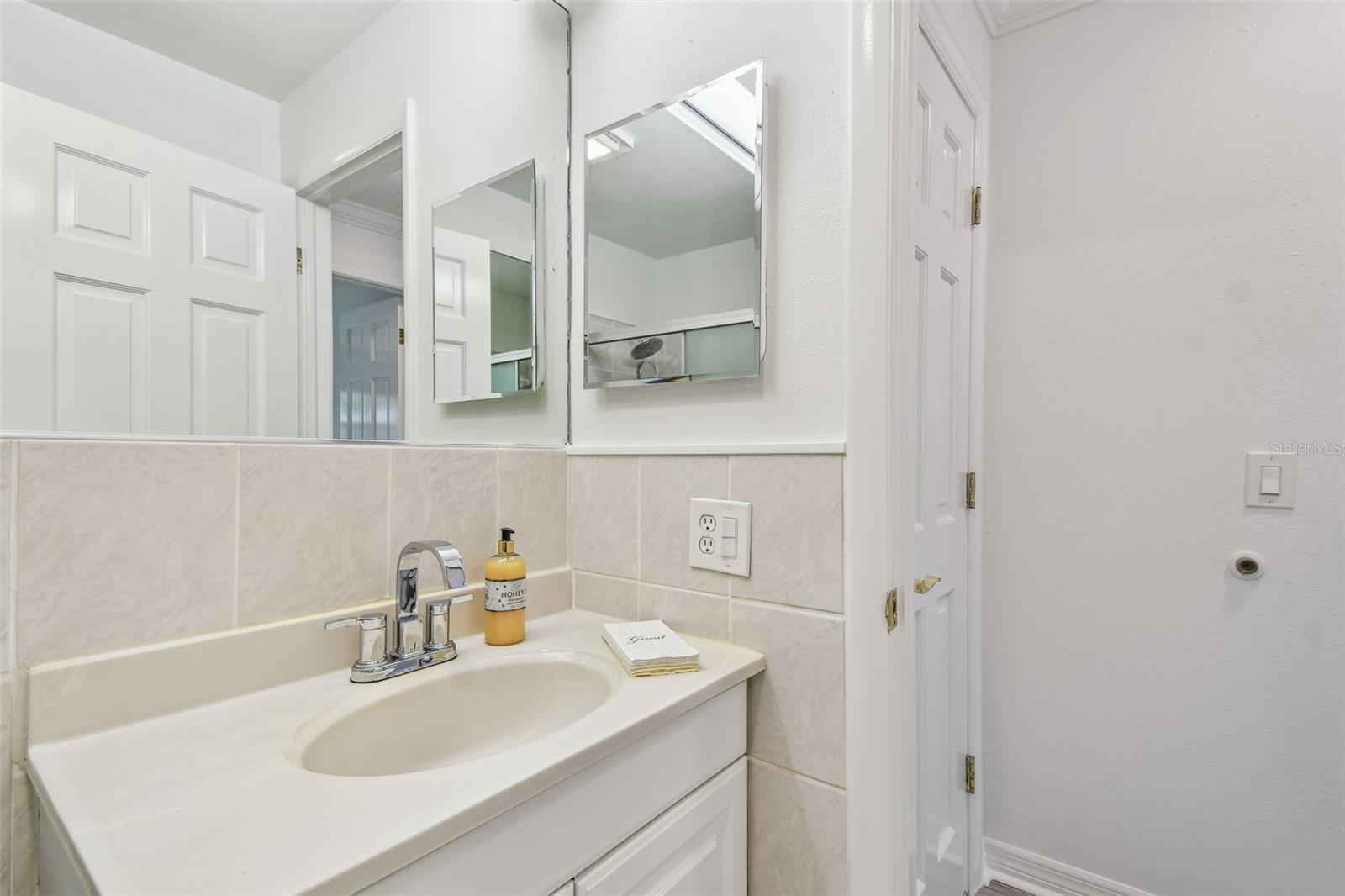 bathroom with linen closet