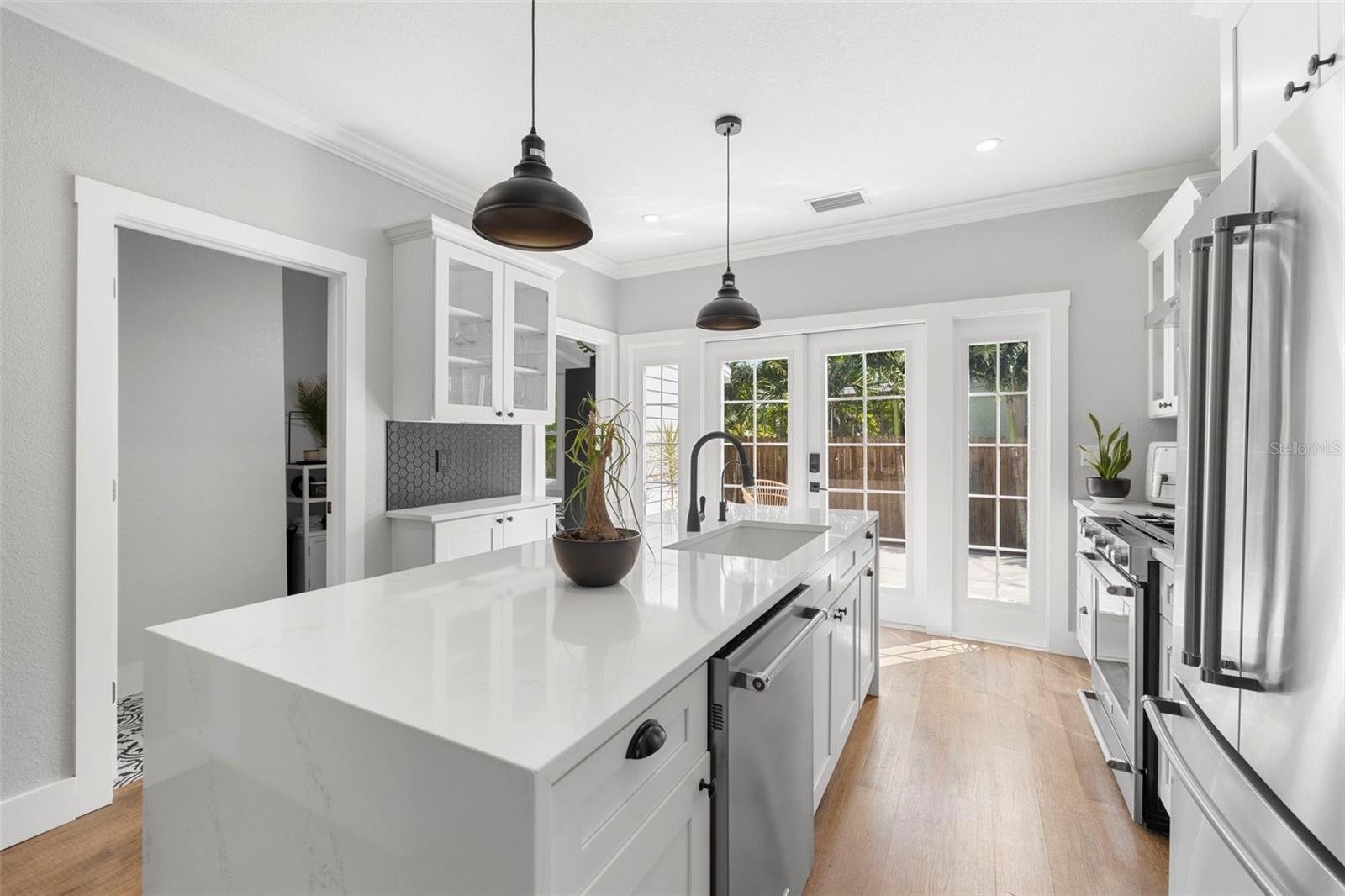 Spacious kitchen and separate laundry room (and half bathroom) right off the kitchen.  French doors open to a beautiful deck for al fresco dining or lounging with family & friends.