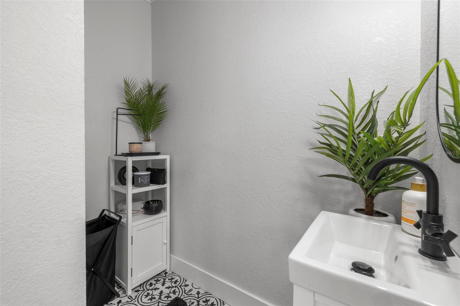 Laundry room has its own little sink area for convenience and toilet (half bathroom).