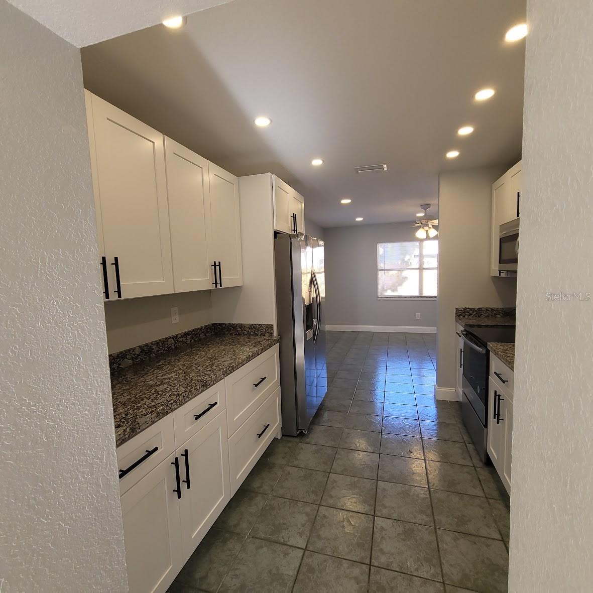 This kitchen has been fully remodeled and has new soft close cabinetry with stylish hardware, brand new appliances, granite countertops and a beautiful double sink!