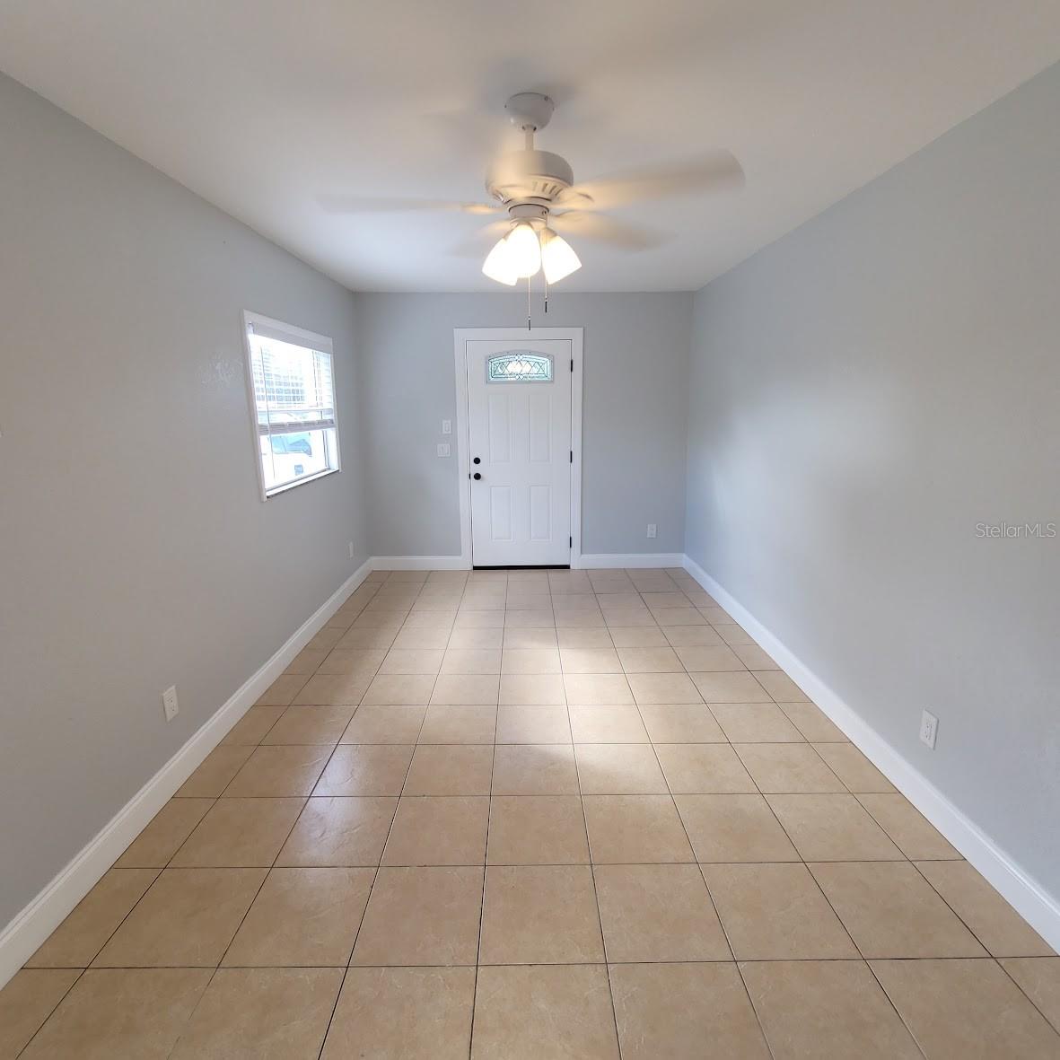 This is the 9.5 X 19 Family Room that has the entrance door and also a side door. This room leads to the kitchen as you will see in the next photo.