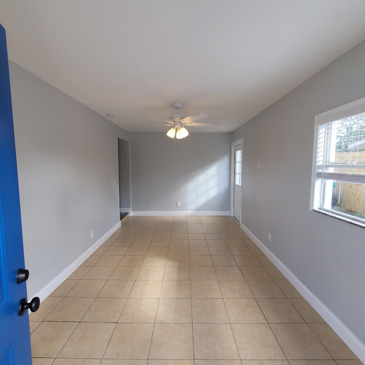 The back of the home just beyond the utility room.