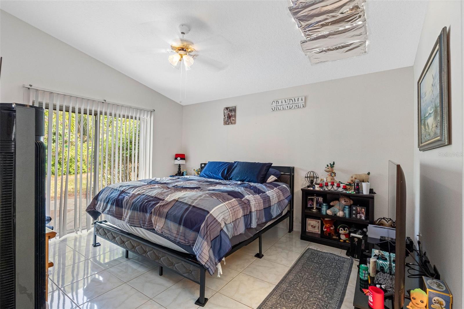 Master bedroom view, with sliders to outside paitio