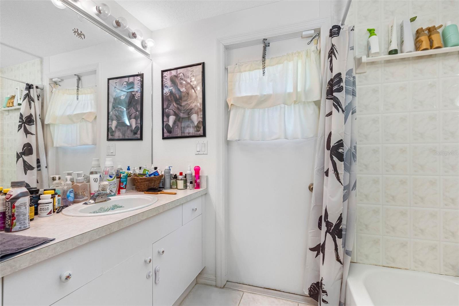 bathroom 2- hallway, with access to back patio