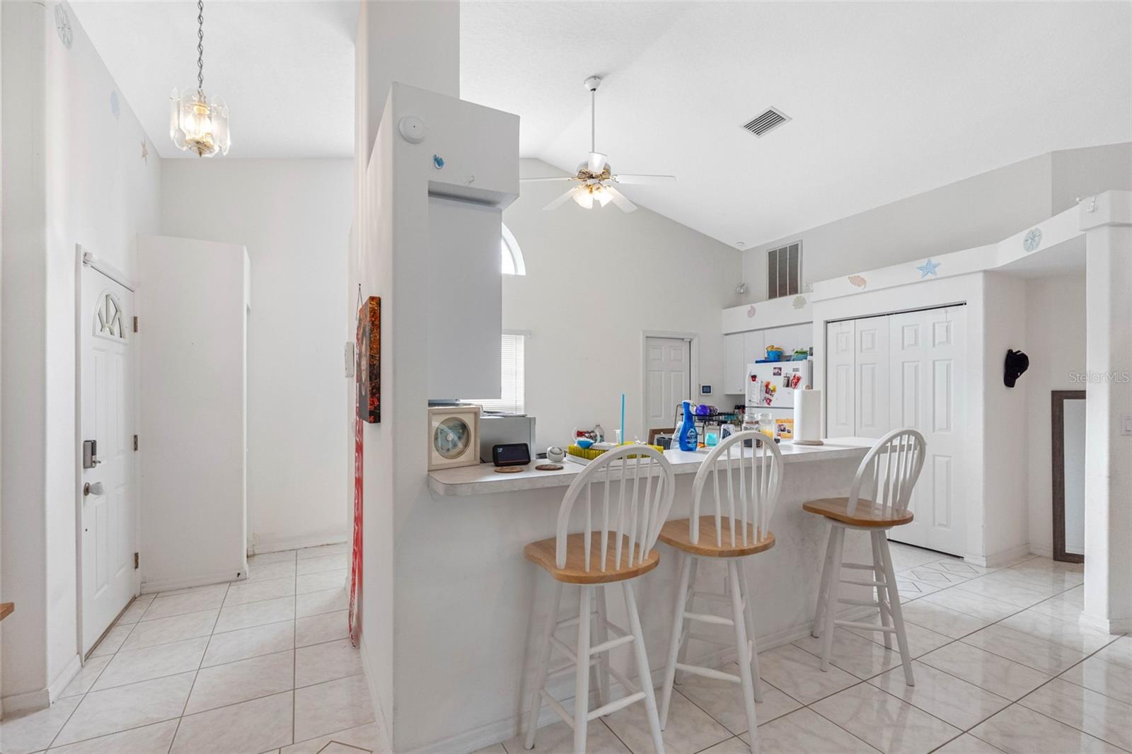 vaulted ceilings & view into kitchen