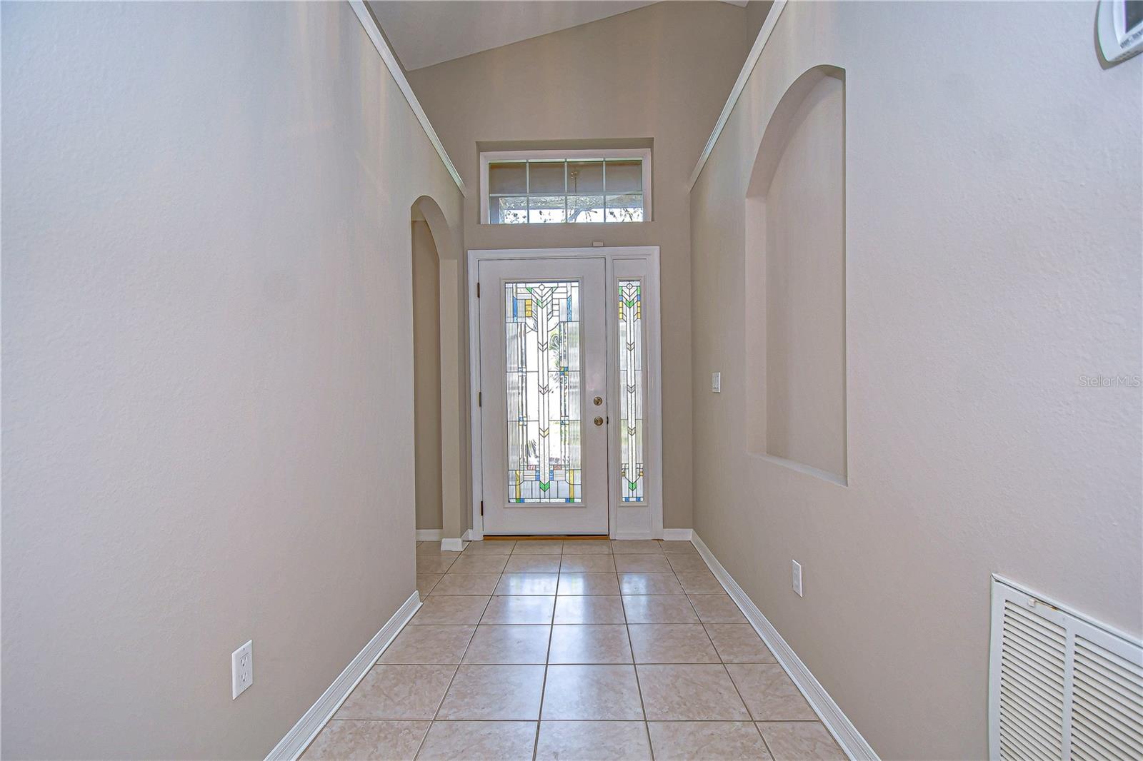 Enter through the front doors into an open foyer with high ceilings!