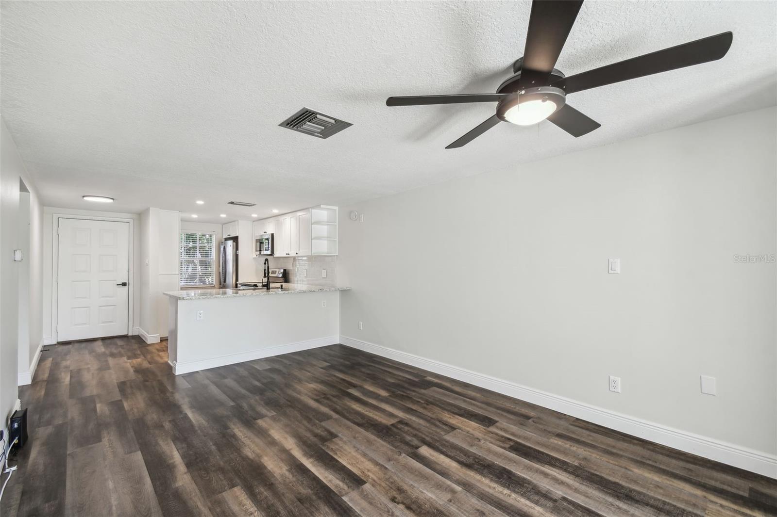 NEW LUXURY VINYL PLANK FLOORING THROUGHOUT + FRESHLY PAINTED INTERIOR