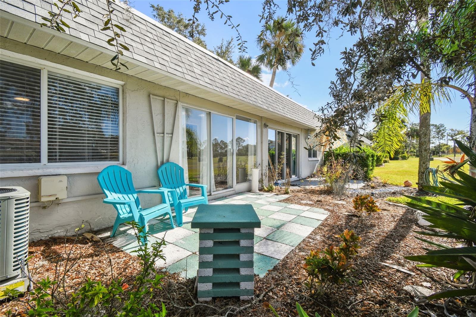 Rear patio with golf course views.