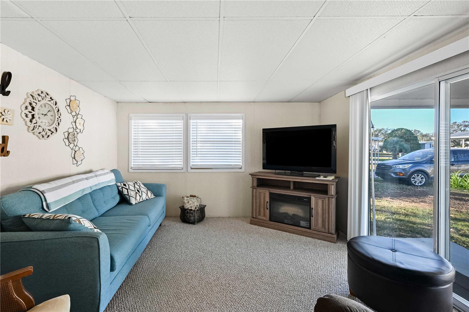 Living room has sliding door to front covered patio area.