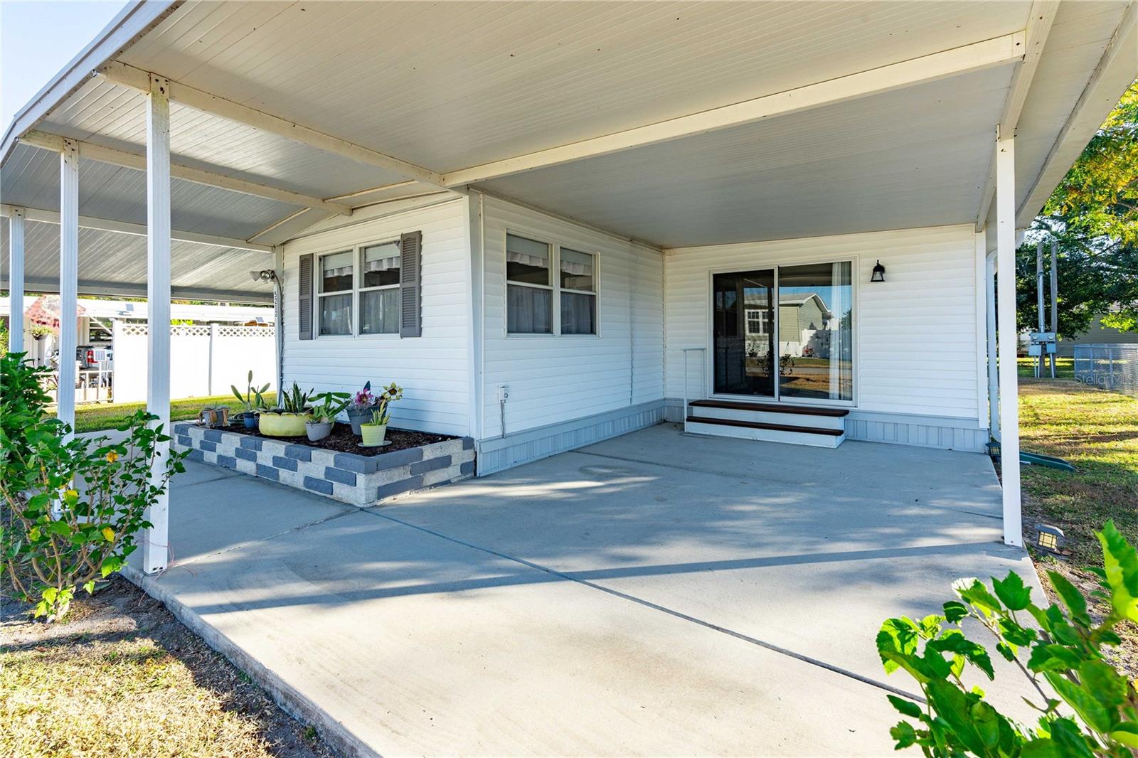 Nice, covered patio on the front of this home.