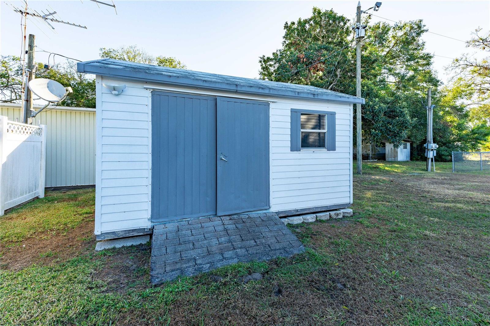 Detached shed/golf cart storage.