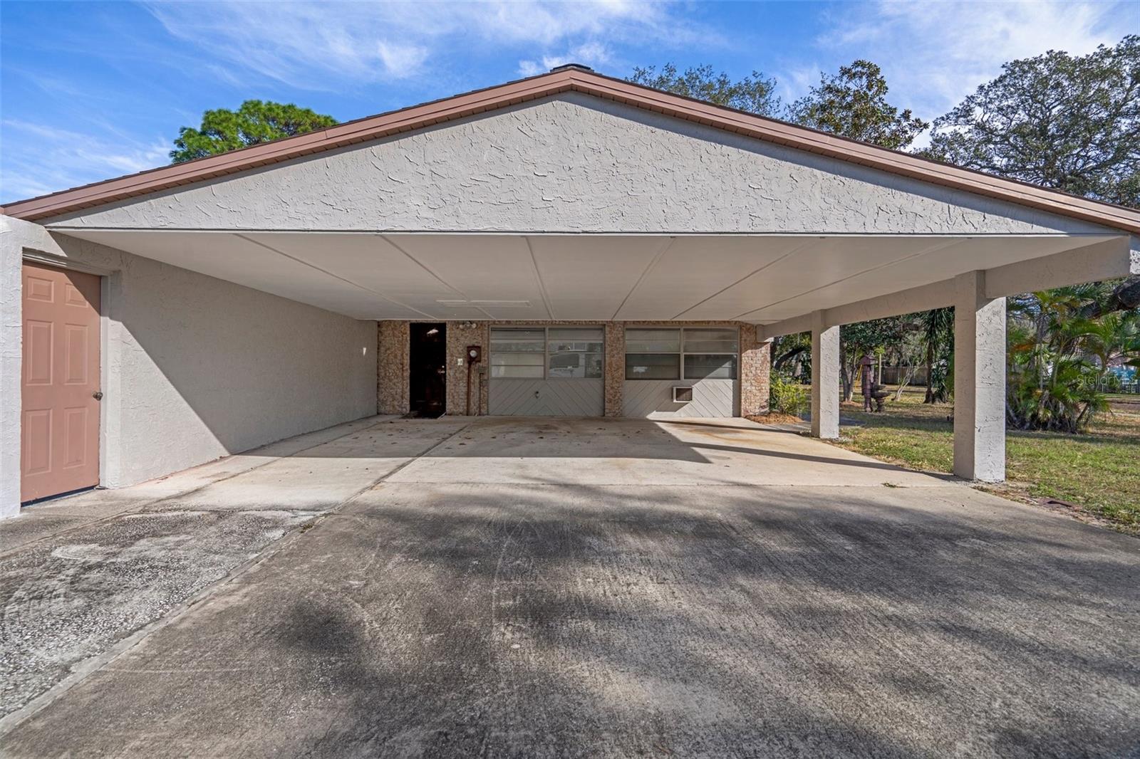 Entrance from carport - could be a private in-law suite entrance