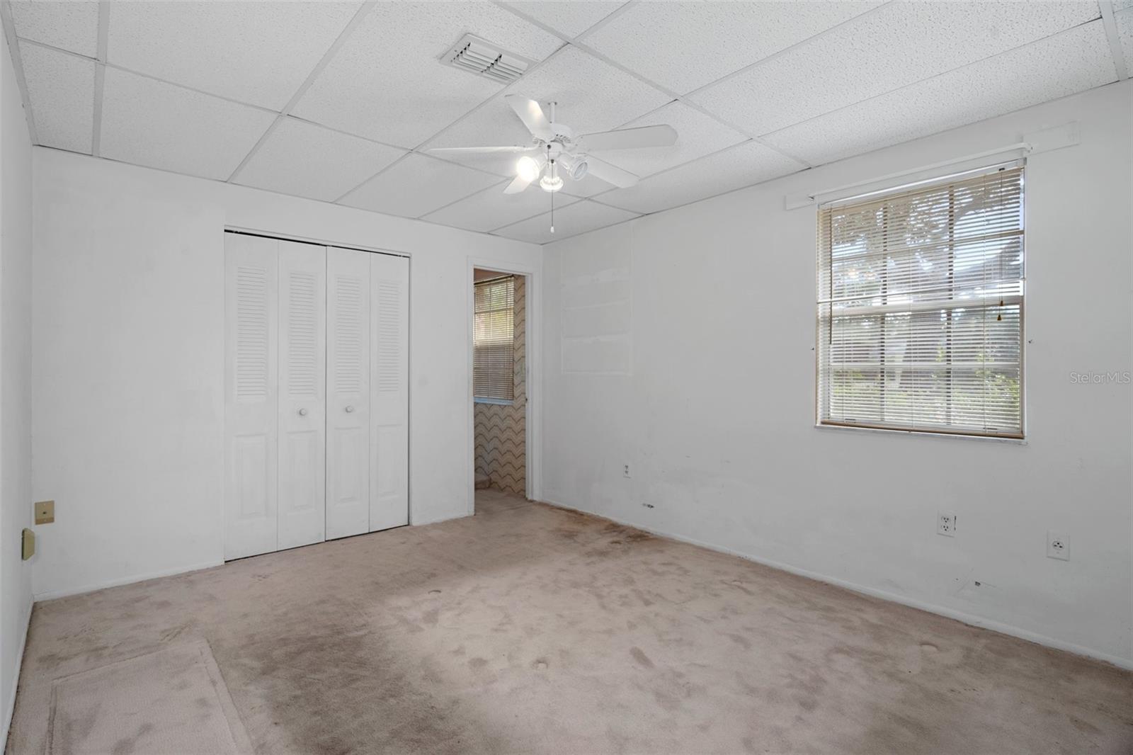 1st guest bedroom with ensuite bath off of the office -1st floor